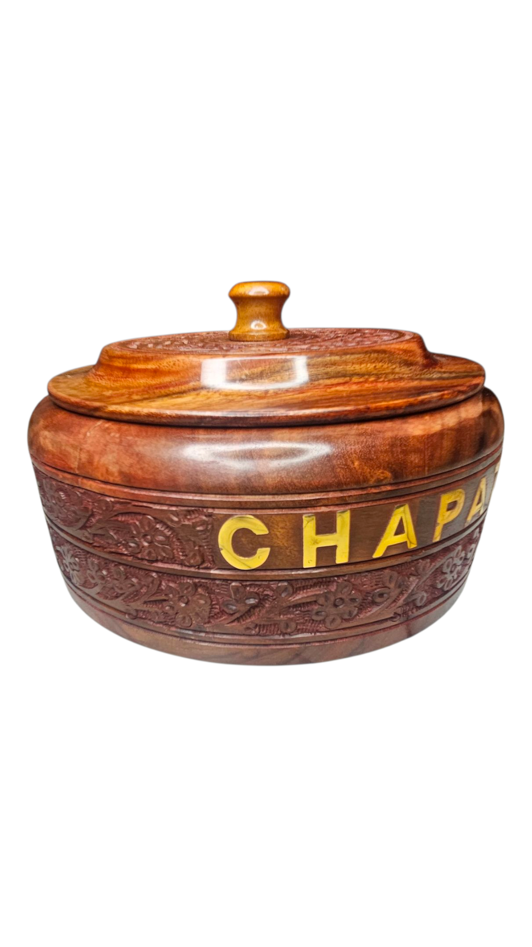 Close-up of floral brass work on chapati box exterior